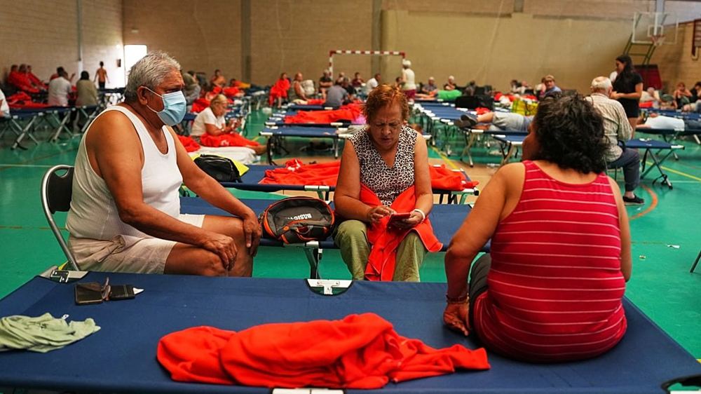 Spain declares unprecedented wildfire emergency as 10,000 flee Madrid