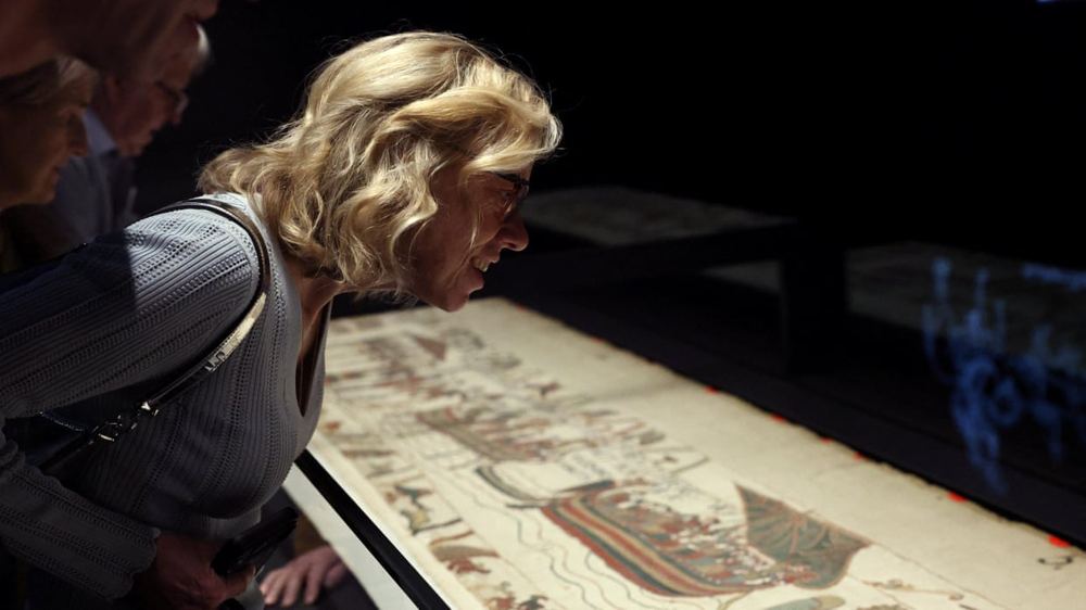 Francophiles, Norman outfits and broken threads: visitors see Bayeux tapestry in UK for first time