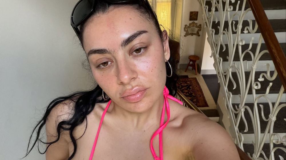 Charli XCX hits back at intense fan backlash over her lack of European tour dates as she insists that touring is 'emotionally and physically hard'